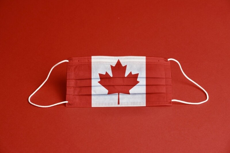 This is a picture of a face mask styled to look like the Canadian flag. 