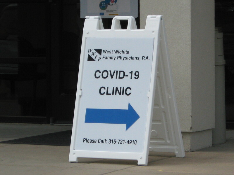 A sign directing towards a COVID-19 Clinic.