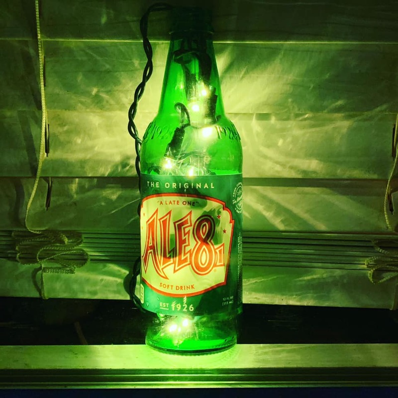 A bottle with green lights. 
