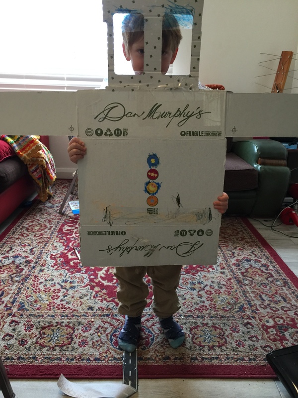 A liquor store box repurposed for a child's arts and craft project. 