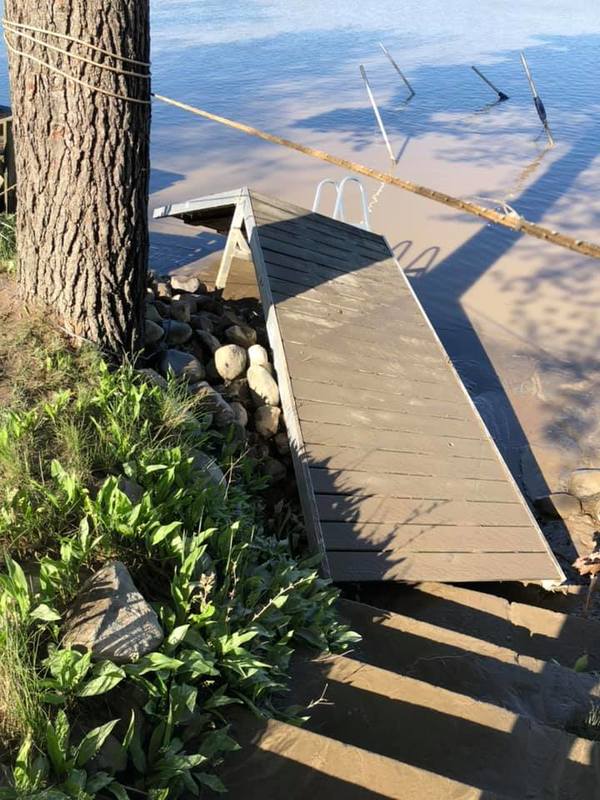 Image of a boat dock that was dislodged during a flood.