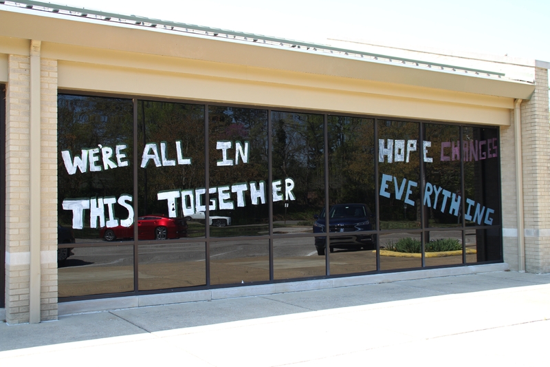 Window Writing reading "We Are All in This Together. Hope Changes Everything".