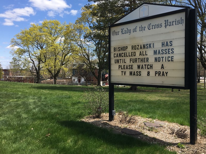 A sign outside of a church. 