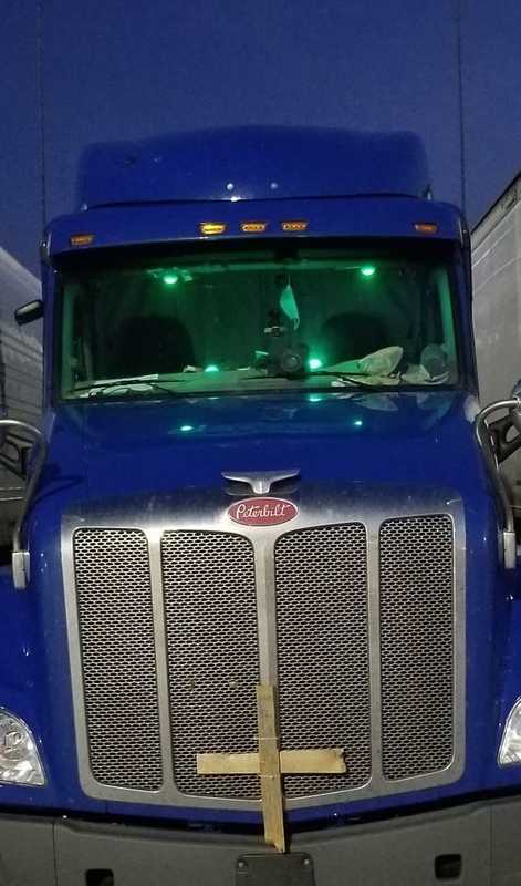 A truck with green lights. 