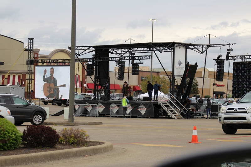 Photo of a stage in a mall parking lot.