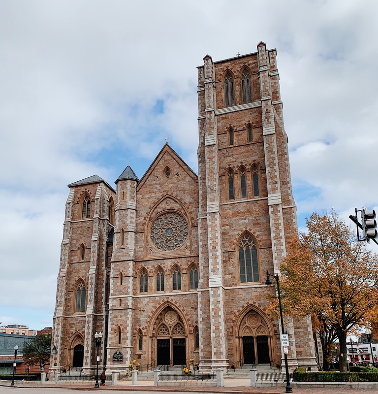 Picture of the outside of the Cathedral of the Holy Cross in Boston, Massachusetts taken from the street. 