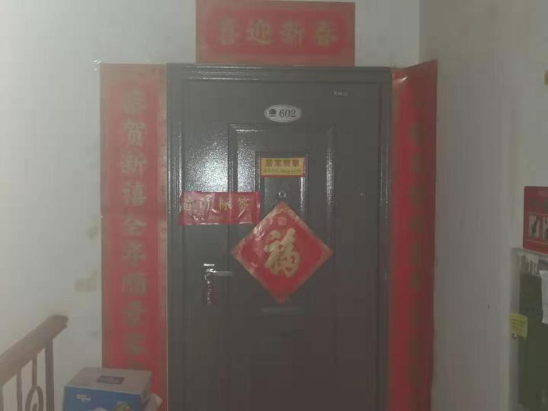 A door covered in red and gold writing. 