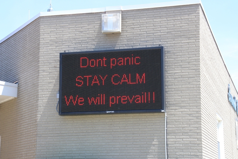Digital Sign reading "Don't Panic. STAY CALM. We will prevail!!".