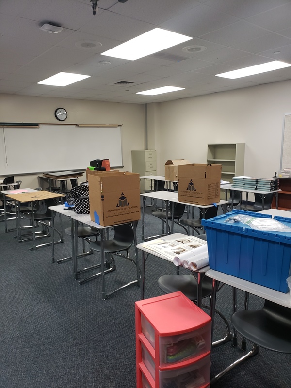 Boxes on tables in a classroom. 