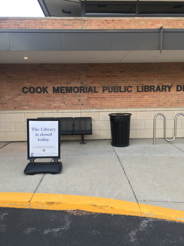 Cook Memorial Public Library informing the public that it is closed. 