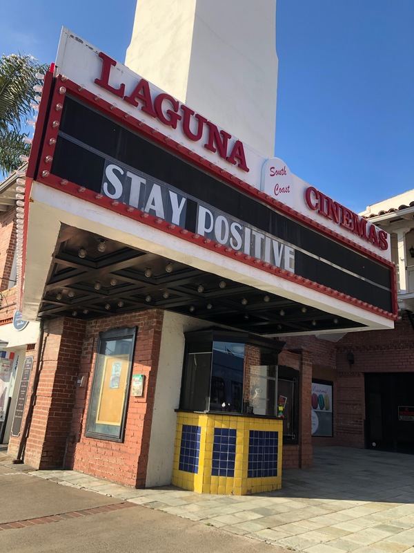 A theater marque with just the words "stay positive" on it