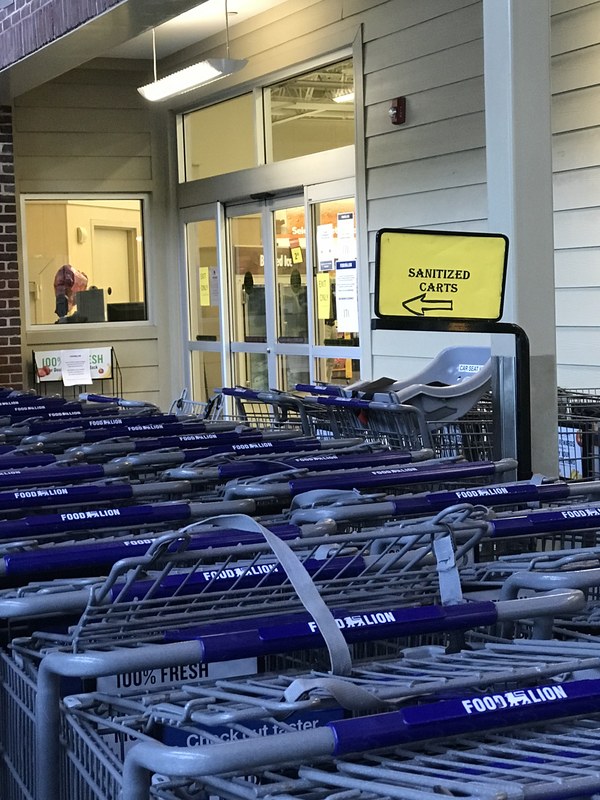 Shopping carts lined up in a row. 