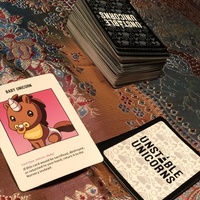A card game that is called "Unstable Unicorns". 