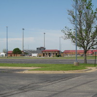 Image of an empty high school football stadium.