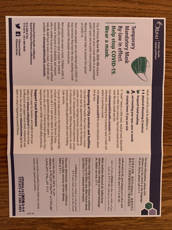 A pamphlet in English detailing mandatory masking procedures.