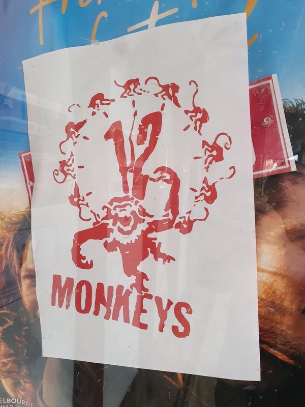 A flyer on a glass window.