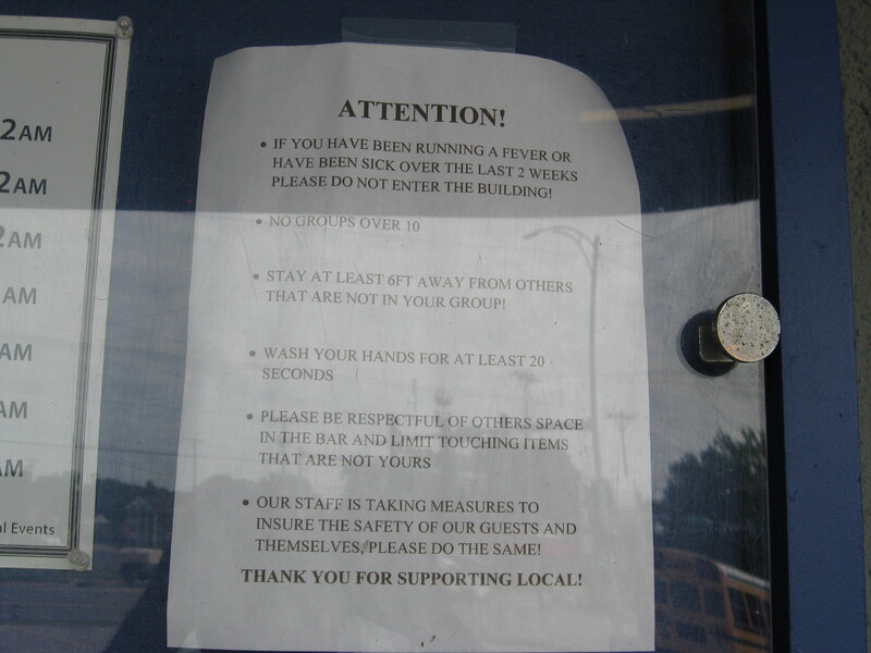 A notice of a bar's COVID-19 protocol.