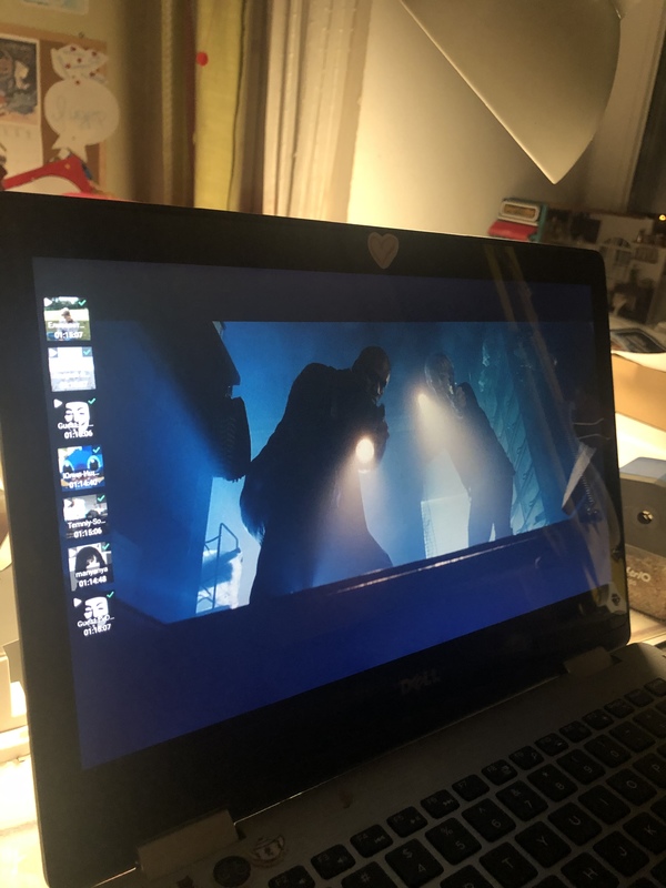 A movie playing on a laptop.