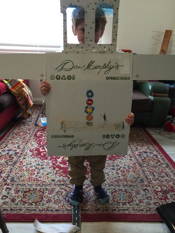A liquor store box repurposed for a child's arts and craft project.