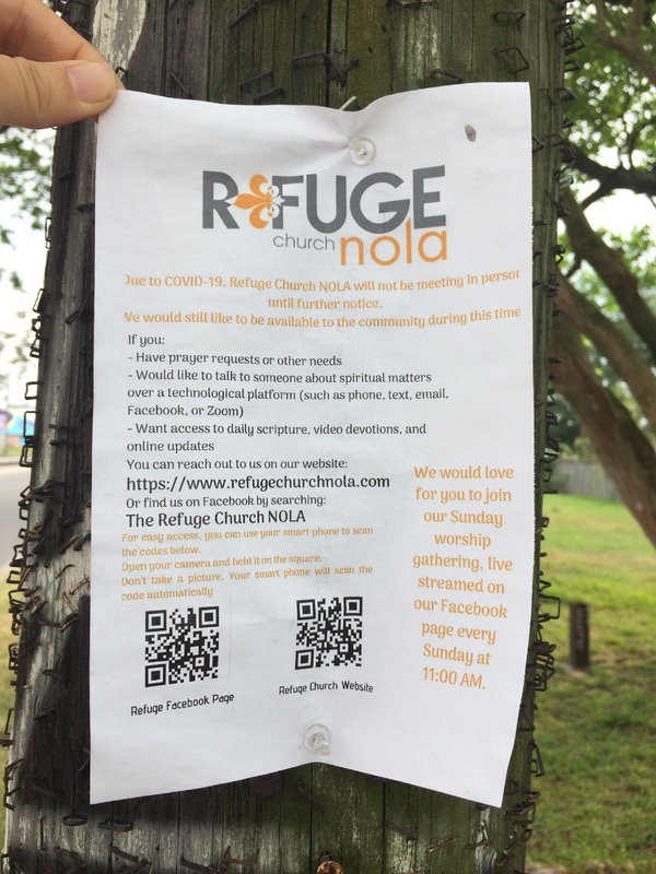 A sign by Refuge Church NOLA informing people that there will be no in person meetings, but that the church will be available via Facebook and their website.