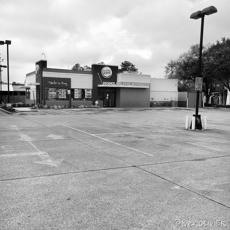 A Burger King with an empty parking lot.
