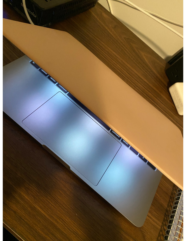 A partially closed laptop. 