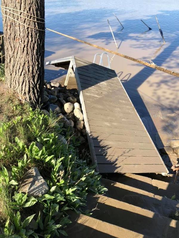 Image of a boat dock that was dislodged during a flood.