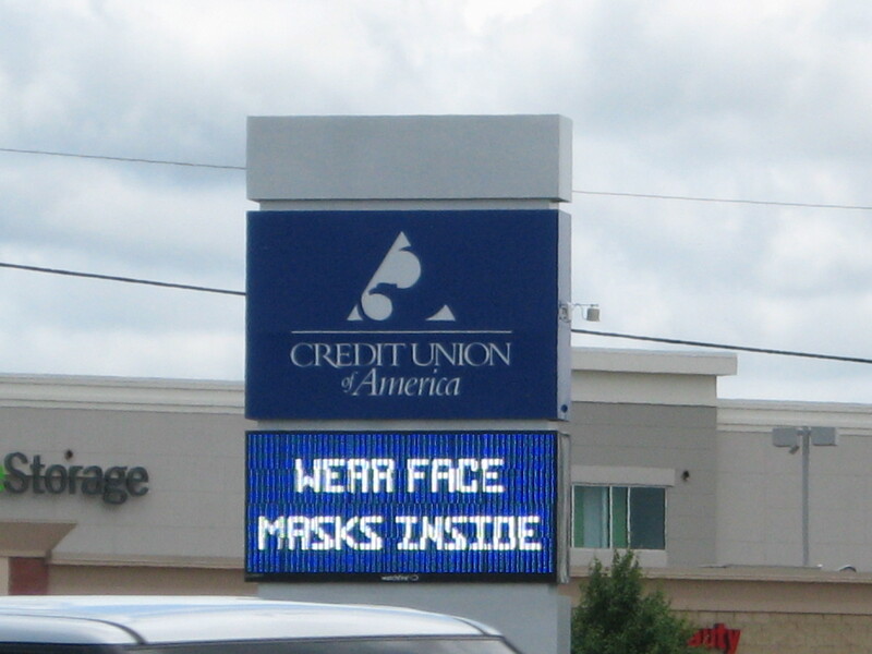 A bank sign reading "Wear Face Masks Inside".