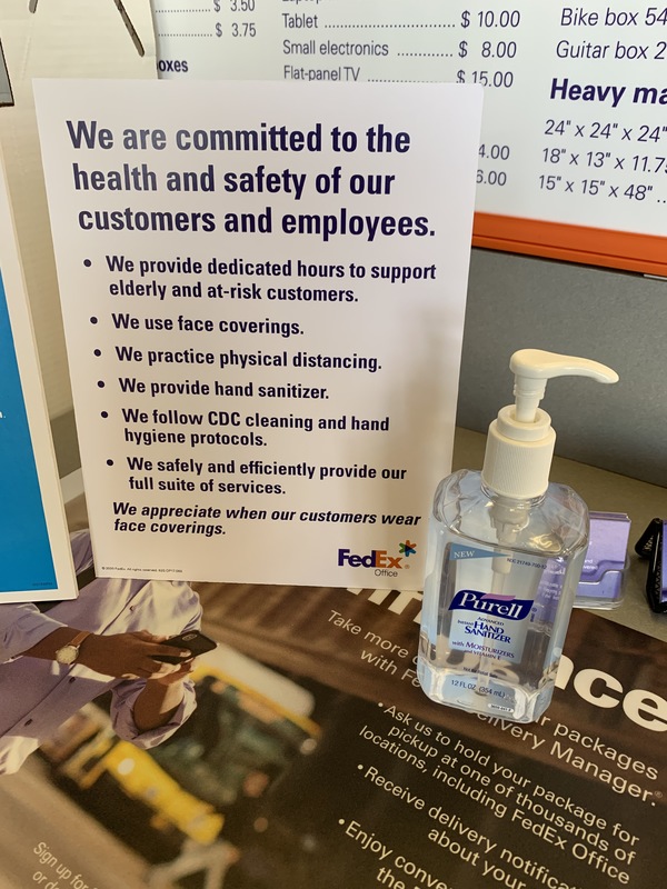 Image of a FedEx sign that says we are committed to the health and safety of our customers and employees. We provide dedicated hours to support elderly and at-risk customers. We use face coverings. We practice physical distancing. We provide hand sanitizer. We follow CDC cleaning and hand hygiene protocols. We safely and efficiently provide our full suite of services.  