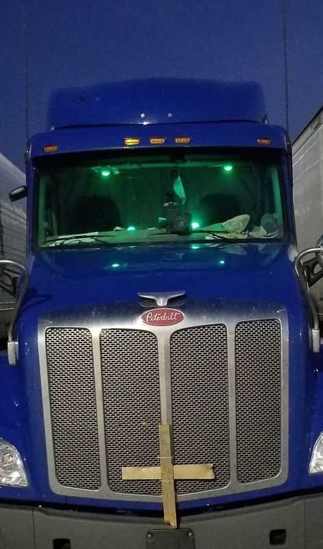 A truck with green lights.