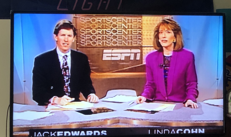 A man and a woman on a news broadcast. 