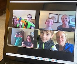 A zoom meeting between multiple people.