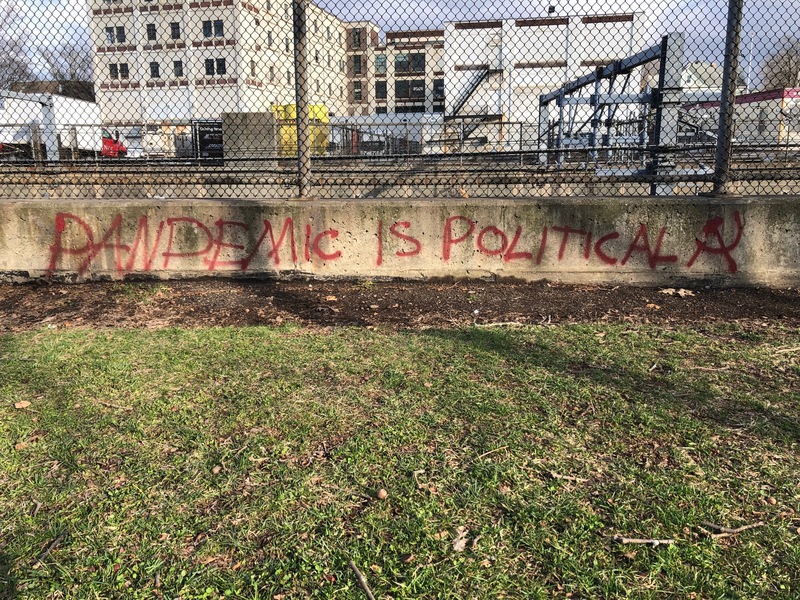 Graffiti area that says "Pandemic is political."