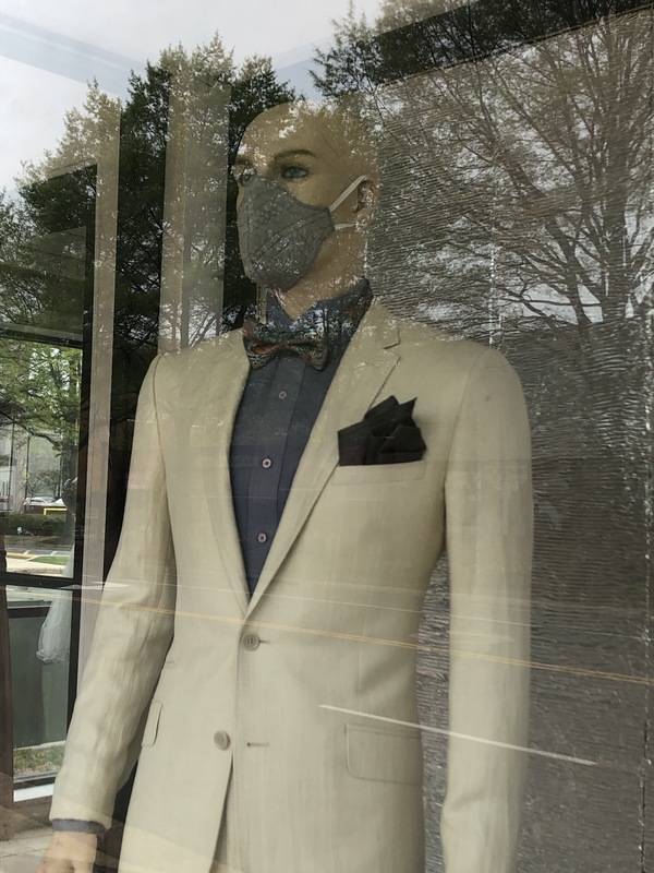 A mannequin with a mask on.