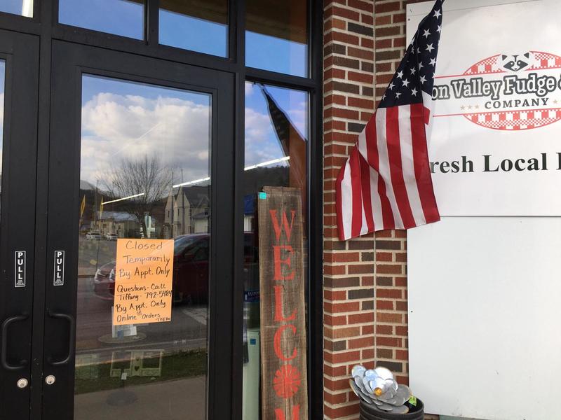 An appointment only sign on a door.