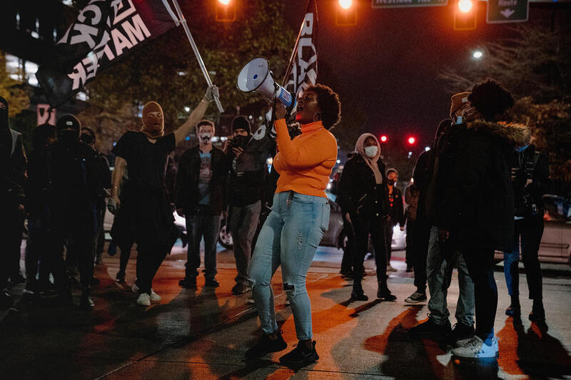 Picture of a group of people protesting for social justice. 