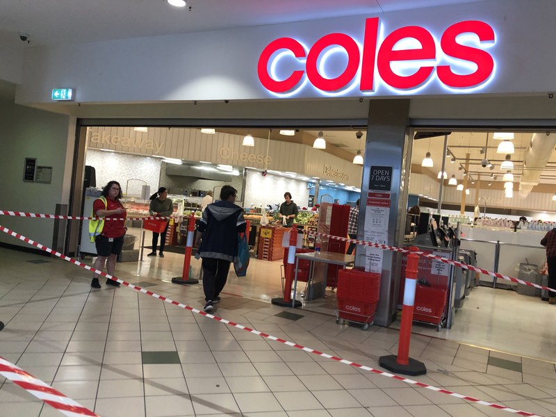 Red lines and orange cones at a supermarket.
