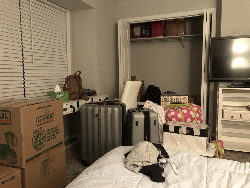 A room that is multiple suitcases and boxes in it.
