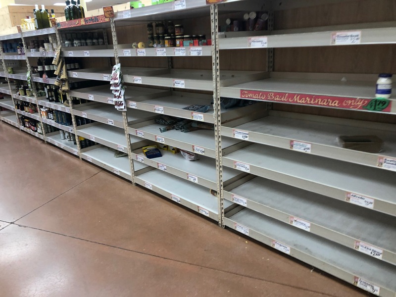 almost empty selves in a grocery store