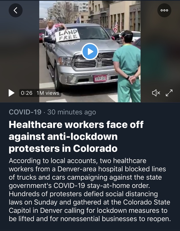 A nurse standing in front of a car.