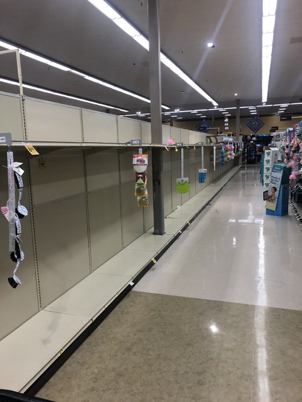 An empty aisle in a grocery store.