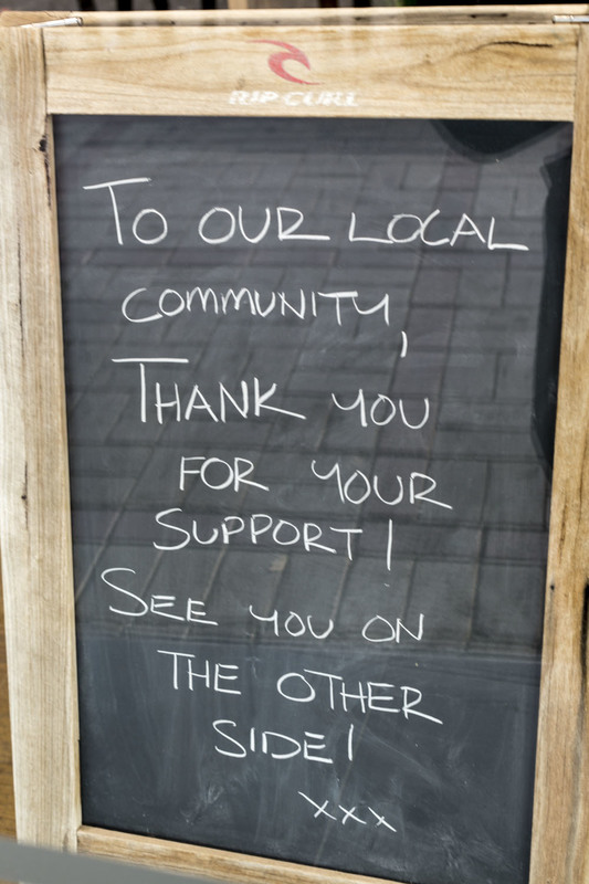 A chalkboard that talks about thanking their community. 