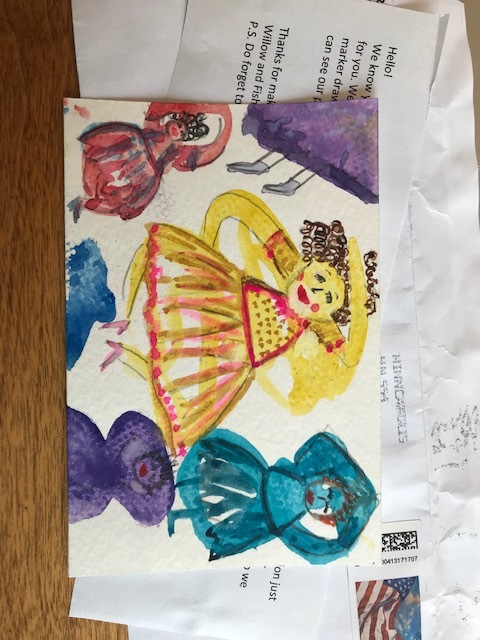 A postcard of three dancing women.