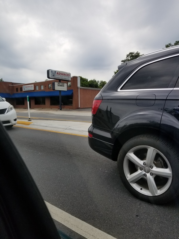 A sign in front of a building.