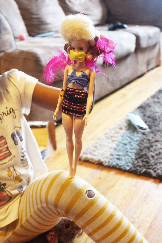 A doll with a mask on.