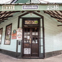 The front door of Carrollton Bar closed, located in New Orleans.