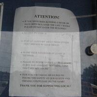 A notice of a bar's COVID-19 protocol.