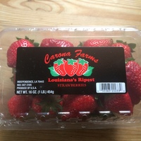 a plastic container of strawberries