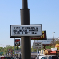 A Sign reading "First Responders and Healthcare Workers Enjoy a Free Meal".