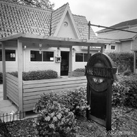 A white house with the sign: THE STATION out front.